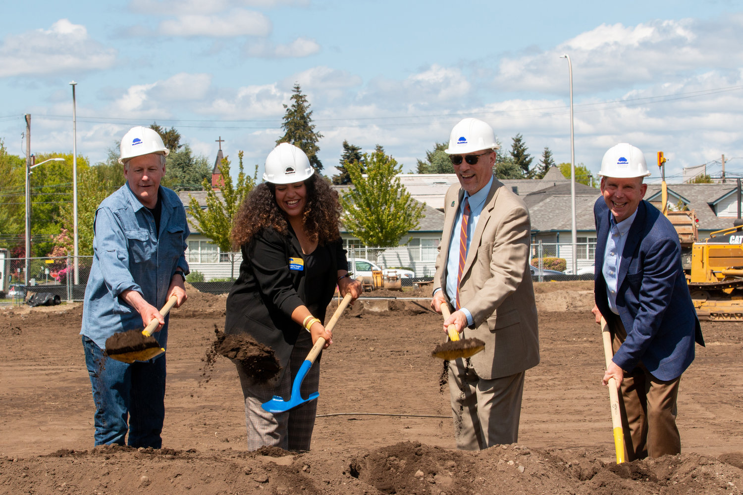 Court Stanley, Board of Trustees member since 2020; Marisol Vargas, Student Body President; Bob Mohrbacher, Centralia College President; and Mark Scheibmeir, Board of Trustees member since 2017, shovel dirt at the groundbreaking event for the Centralia College multi-purpose athletic field Wednesday afternoon.